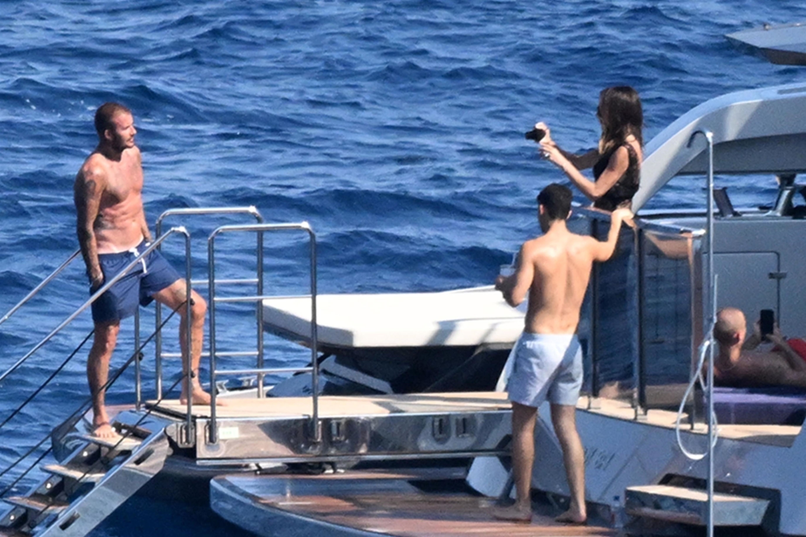 David Beckham and Victoria Beckham on a yacht