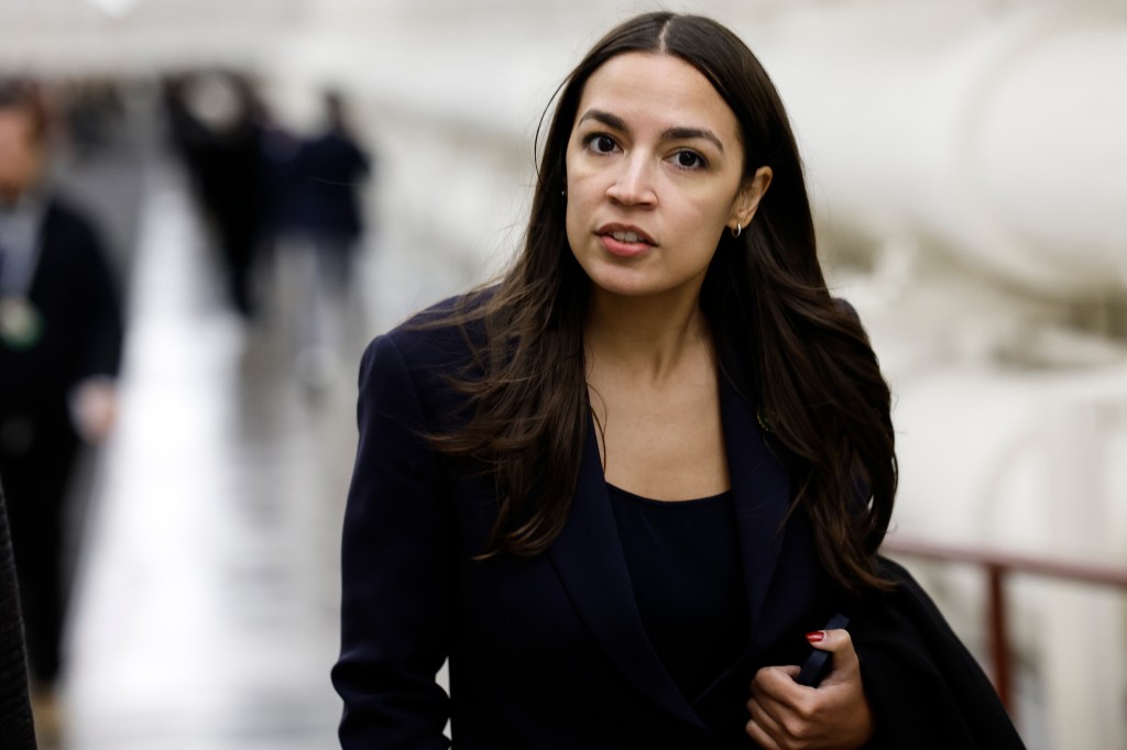 Rep. Alexandria Ocasio-Cortez walking near the U.S. Capitol Building.