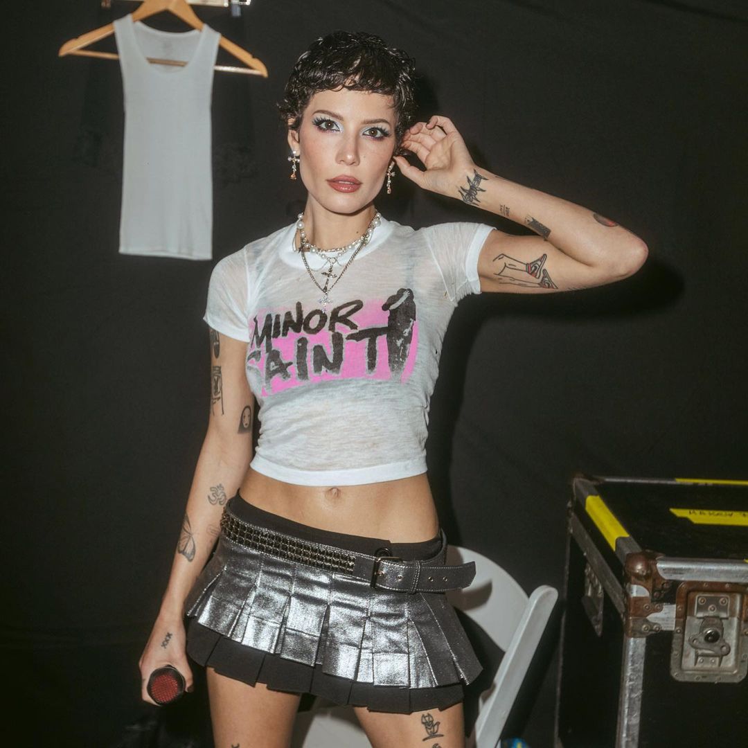 Halsey in a white top and skirt