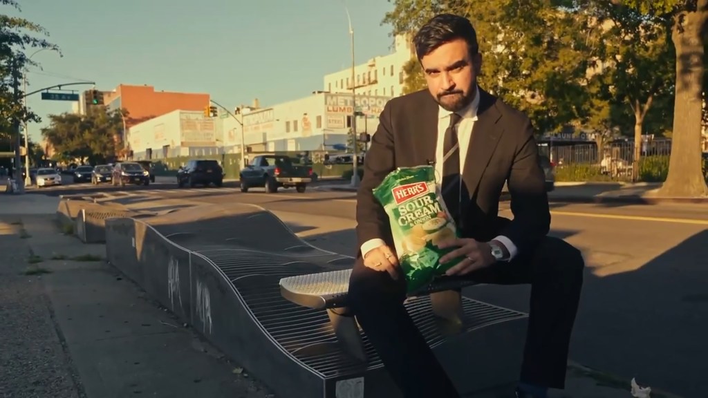Zohran Mamdani holding Herr's Sour Cream & Onion potato chips in new video posted to social media Aug. 23, 2023. 