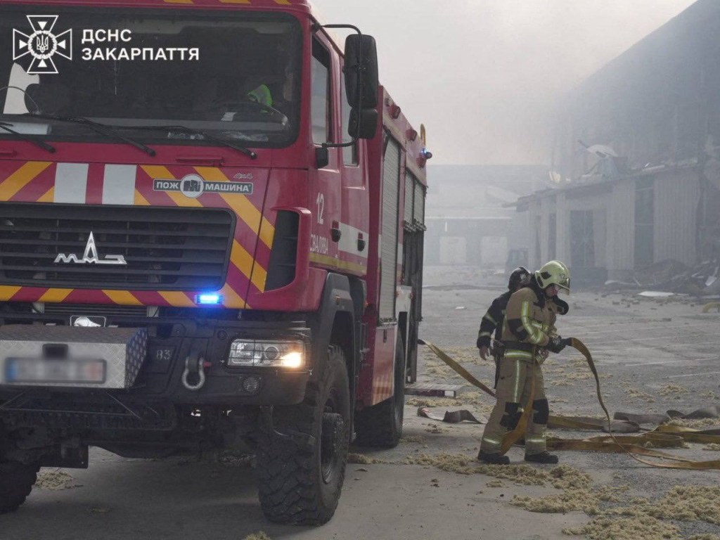 Firefighters at the site of a Russian missile strike in Mukachevo, Ukraine.