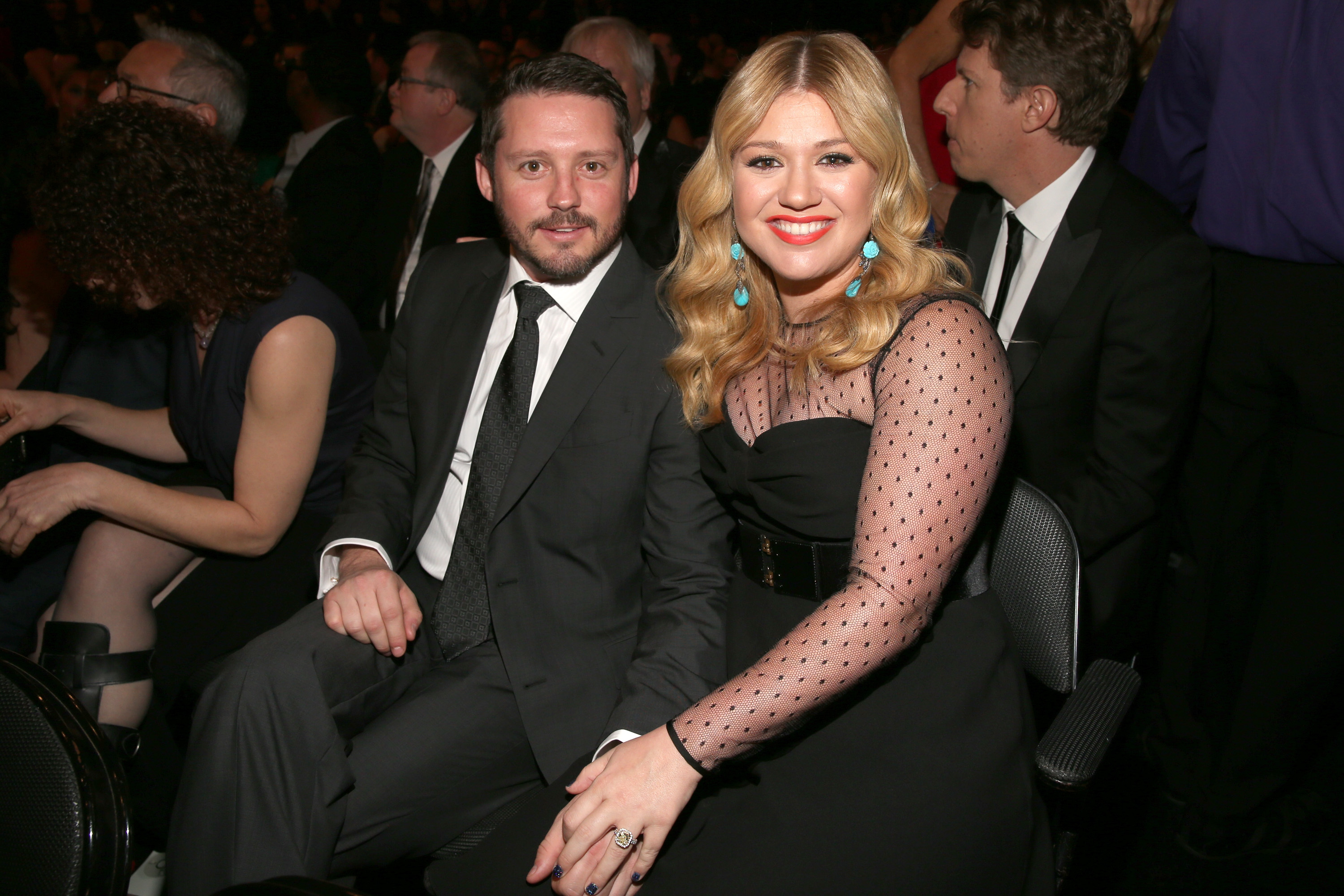 Kelly Clarkson sits with Brandon Blackstock. 