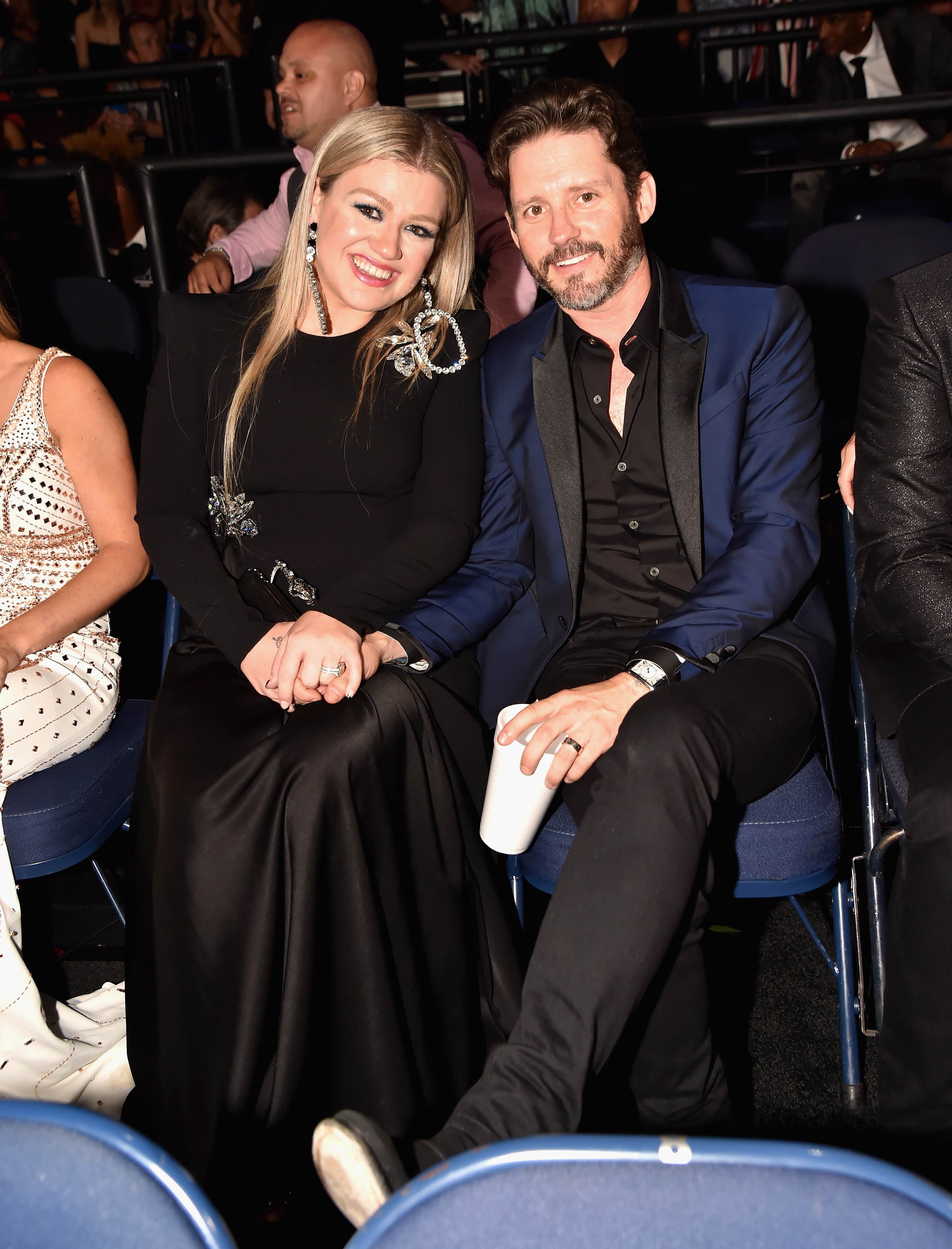Kelly Clarkson and Brandon Blackstock at an event. 