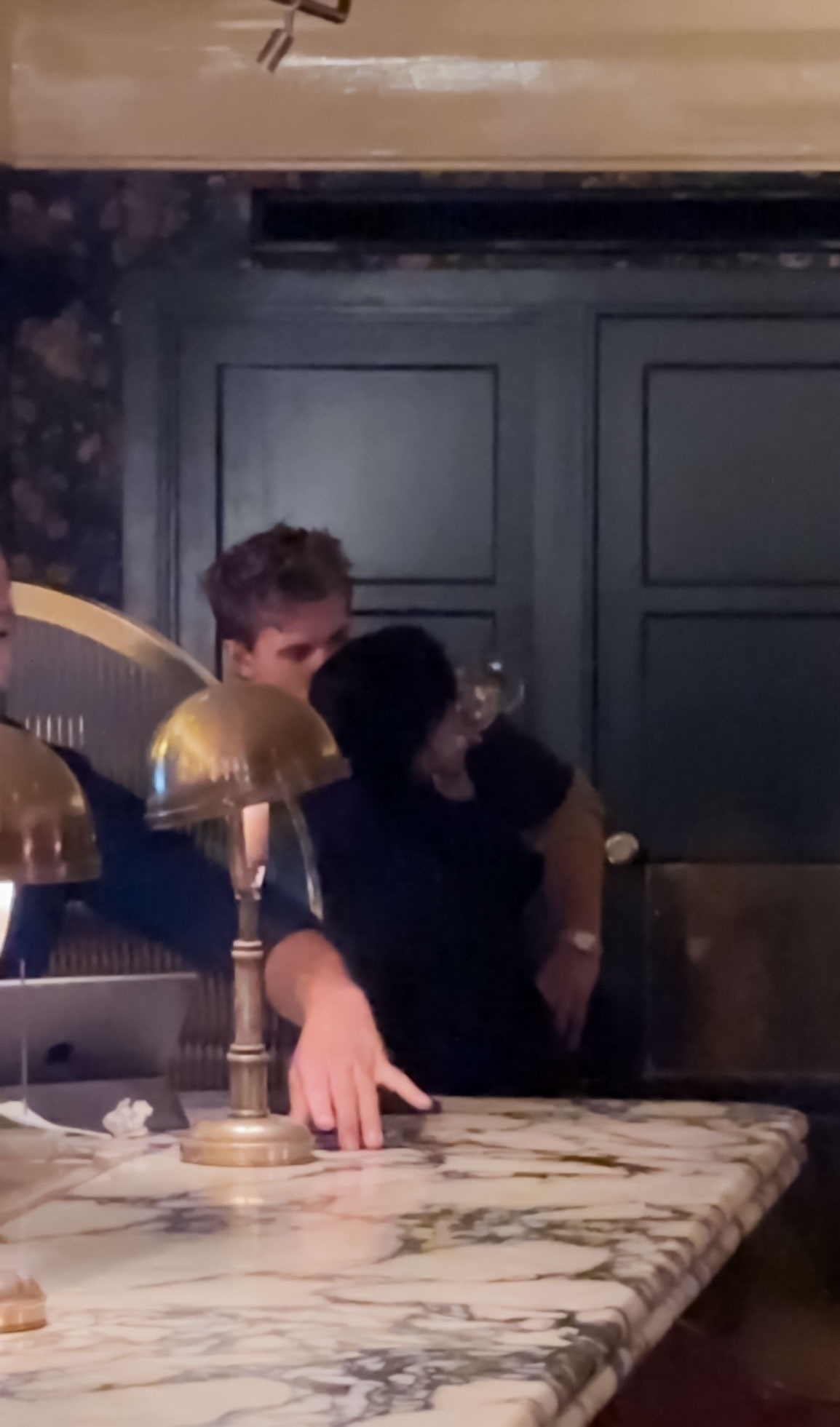 Austin Butler and Zoe Kravitz in a bar. 