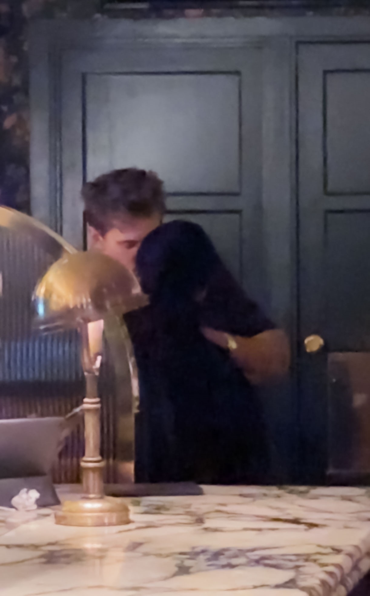 Austin Butler with Zoe Kravitz in a bar. 
