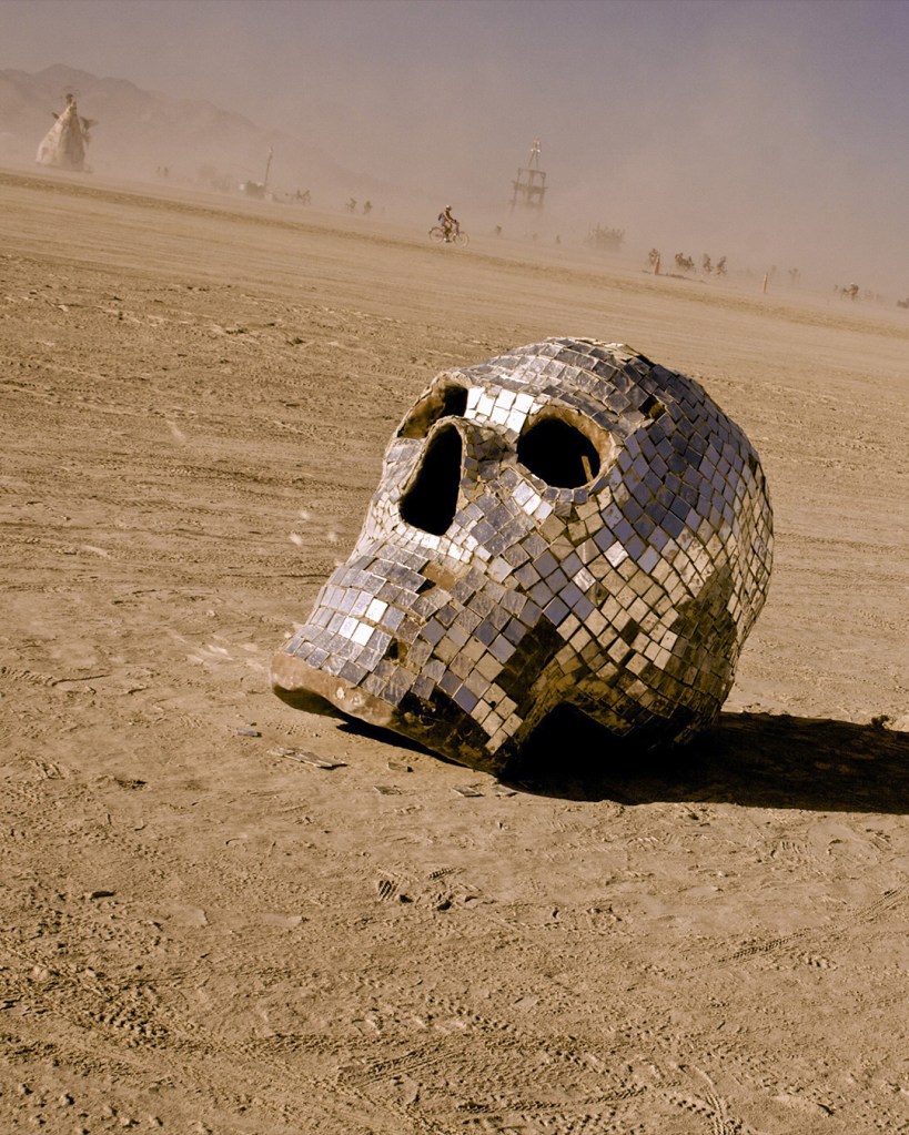 Mirror mosaic skull sculpture at Burning Man.
