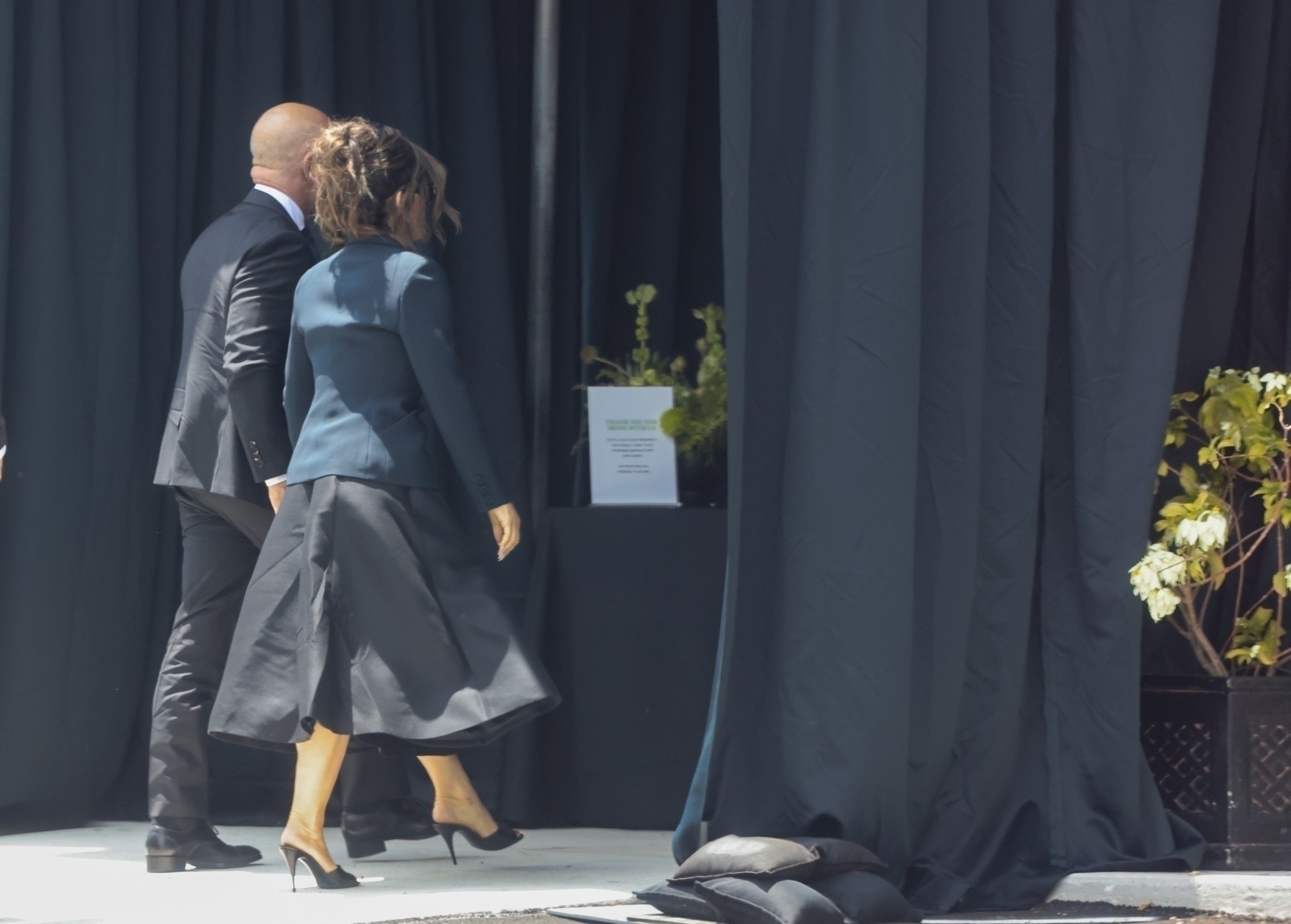 Lauren Sanchez and Jeff Bezos hold hands. 