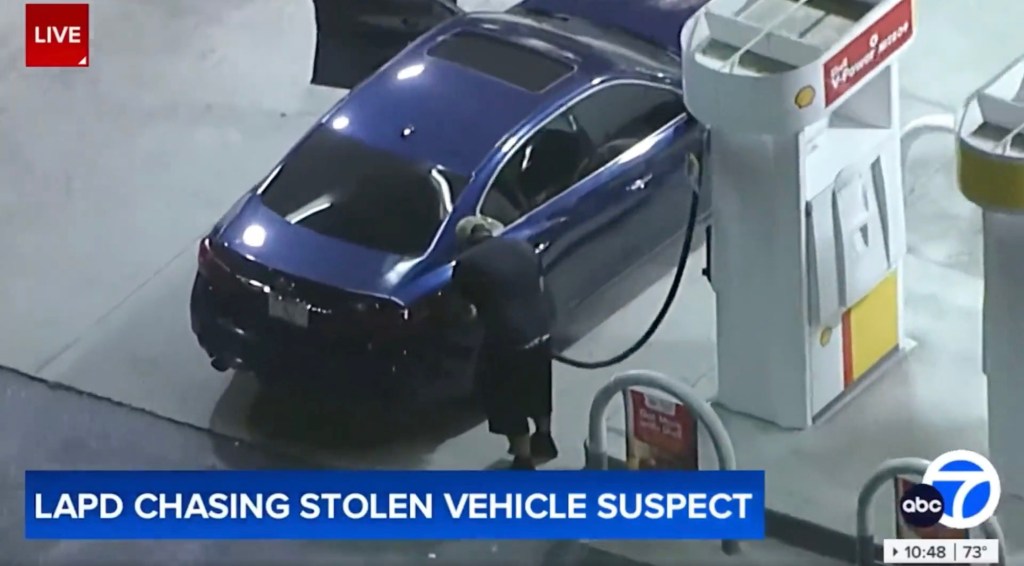 The driver pulled up to a pump at a Shell gas station in Wilshire, Los Angeles, in a pilfered blue Infinity sedan in the middle of a chase with police that saw speeds of up to 100 MPH, KABC reported.