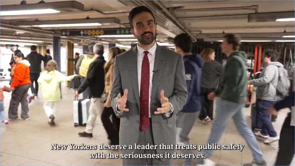 Zohran Mamdani speaking in a New York City subway station about public safety.