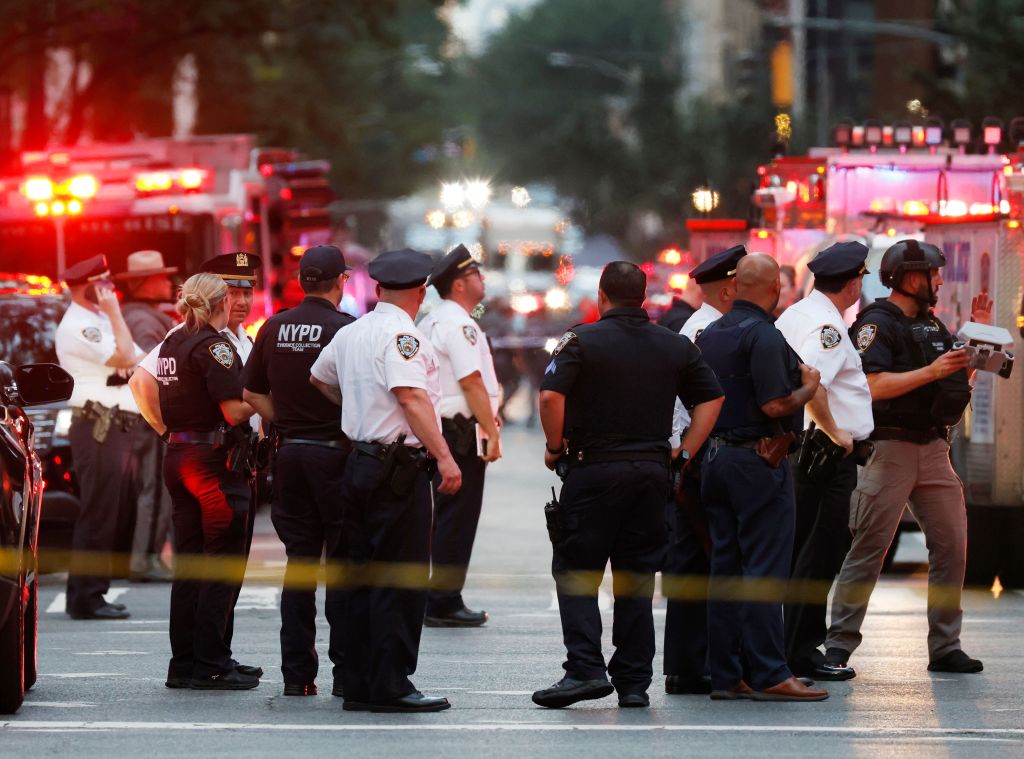 NYPD officers at the scene of a shooting in Midtown Manhattan.