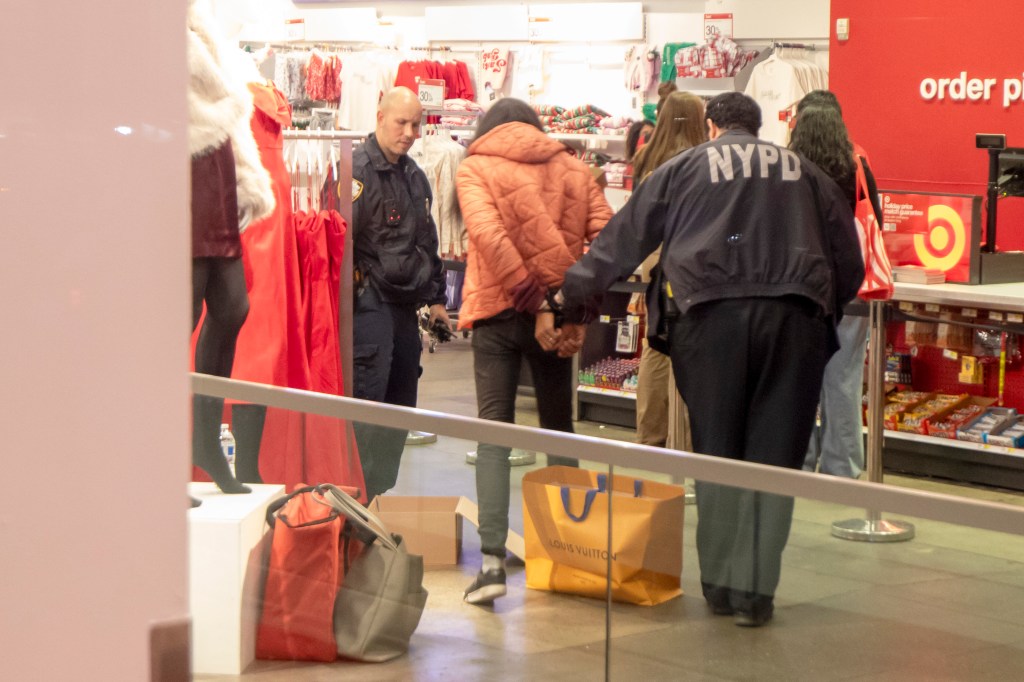 NYPD officers arresting a shoplifting suspect in a Target store.