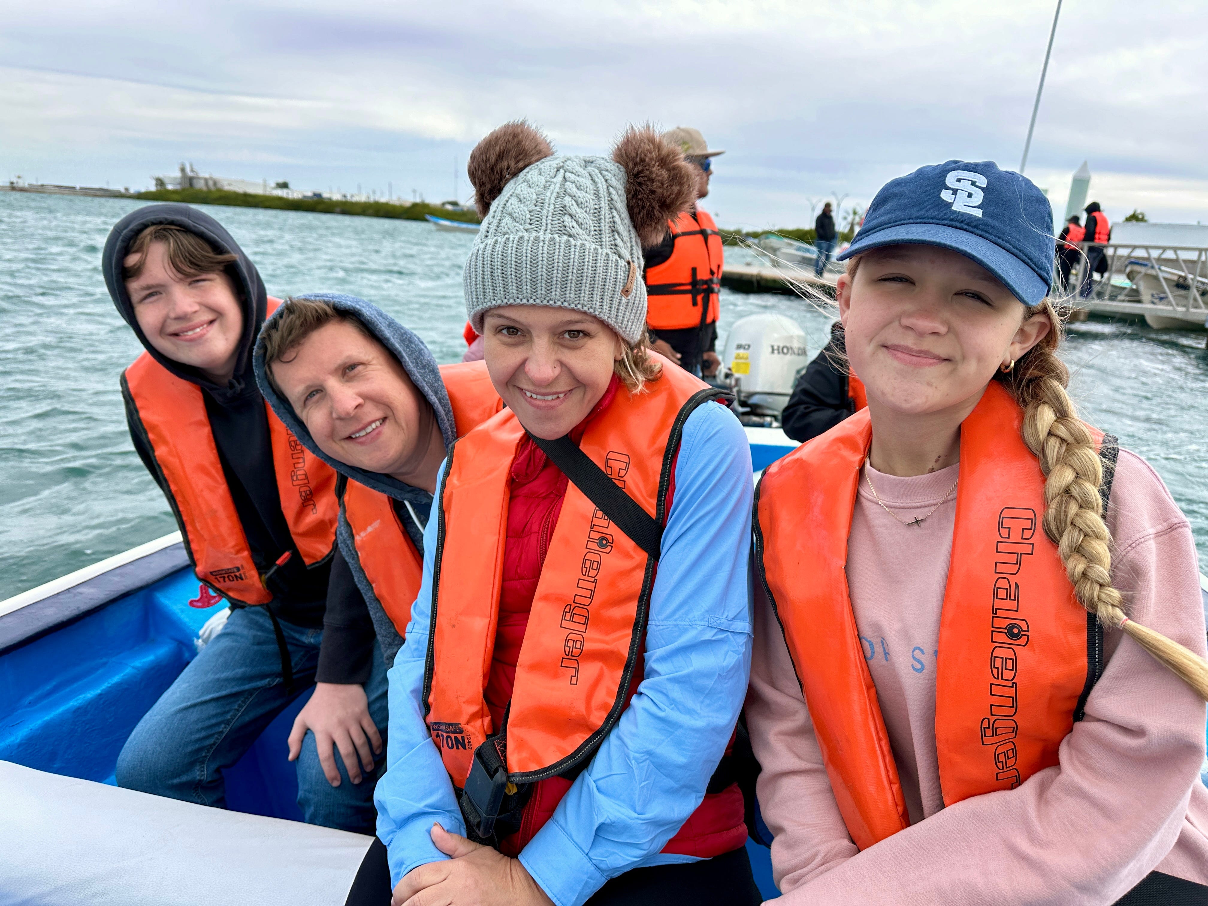 Terri Peters and her family on a boat while whale-watching.