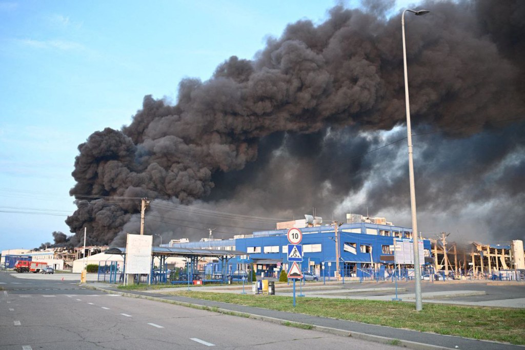 Smoke billowing from burning buildings in Mukachevo, Ukraine, following a Russian air attack.