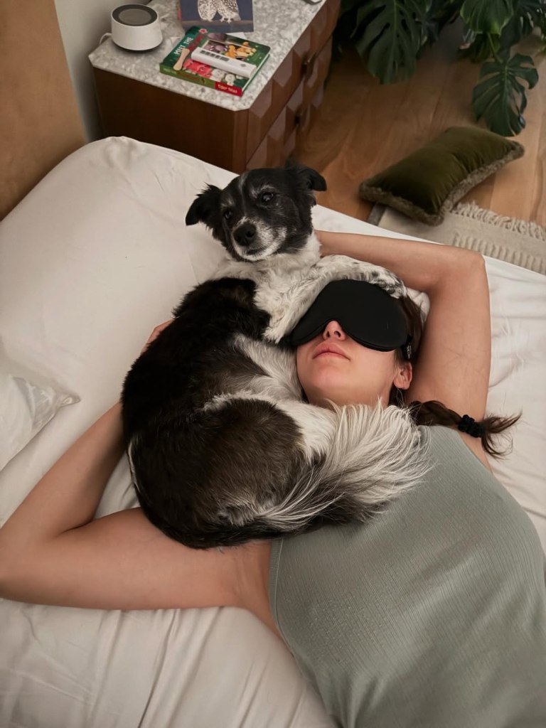 Maverick the dog is an innovator when it comes to sleeping, even acting as a pillow for mom Nina Dobrev.