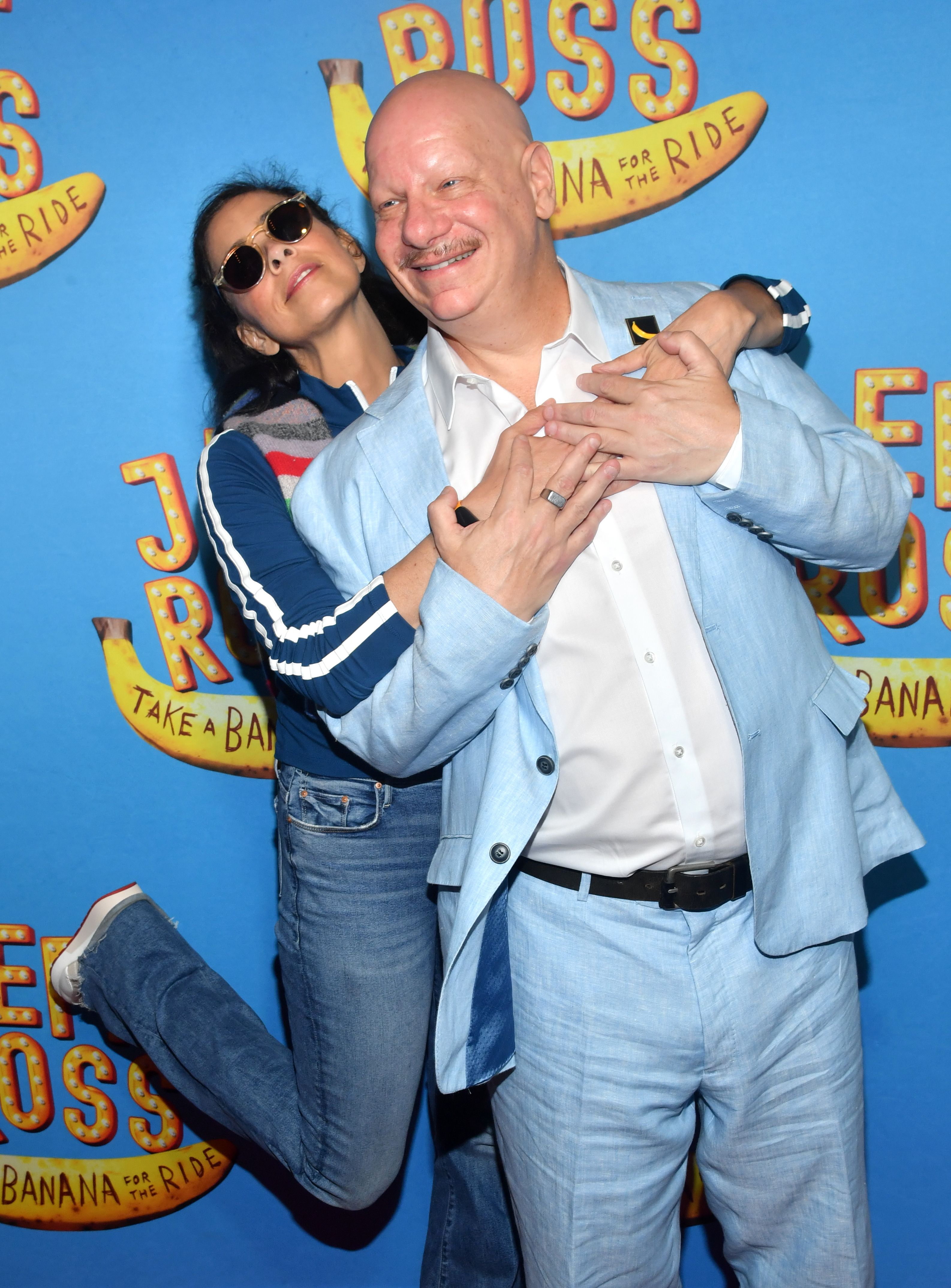 Comedian buddies Sarah Silverman and Jeff Ross embrace at the premiere of his Broadway show “Take a Banana for the Ride.”