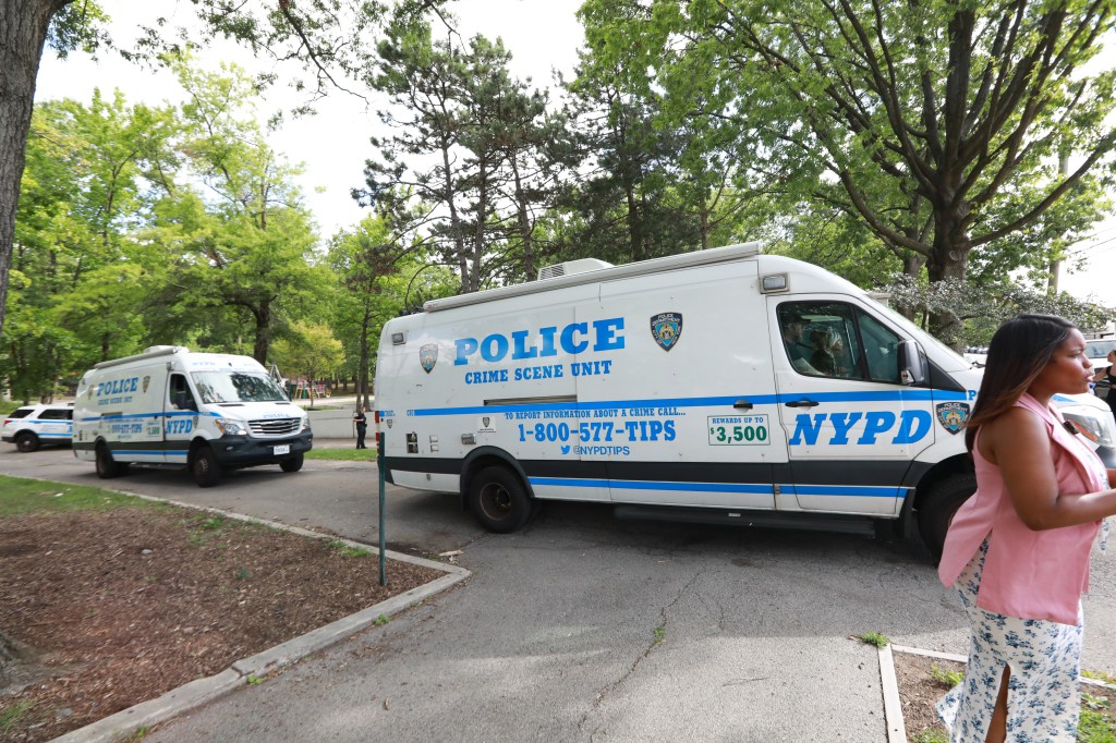 NYPD crime scene unit vans at a park.