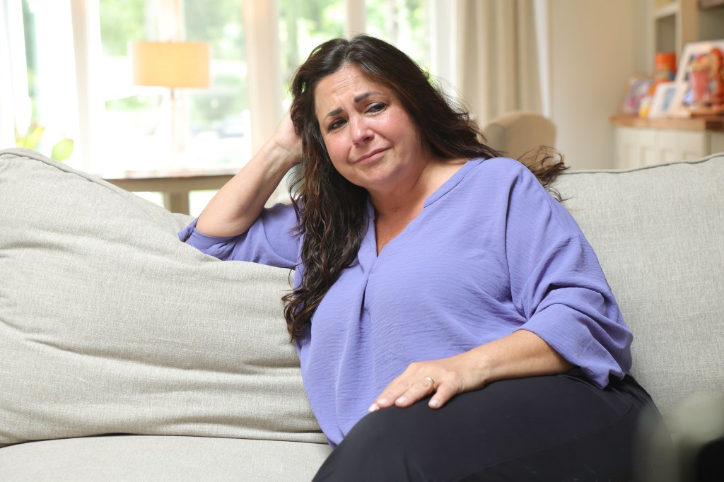Karen Freed, sitting on a couch, reflects on her dog's death.