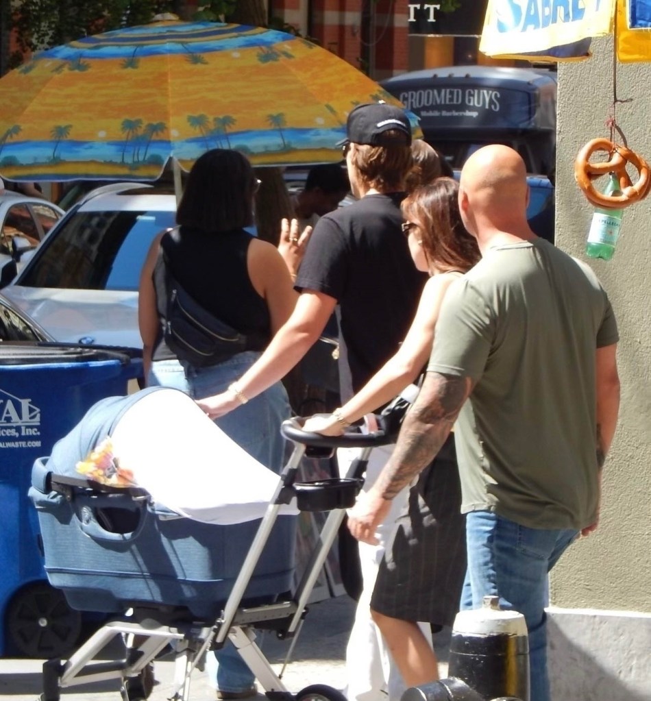 Millie Bobby Brown and Jake Bongiovi take their adopted baby out for a stroll on Prince St. in SOHO.