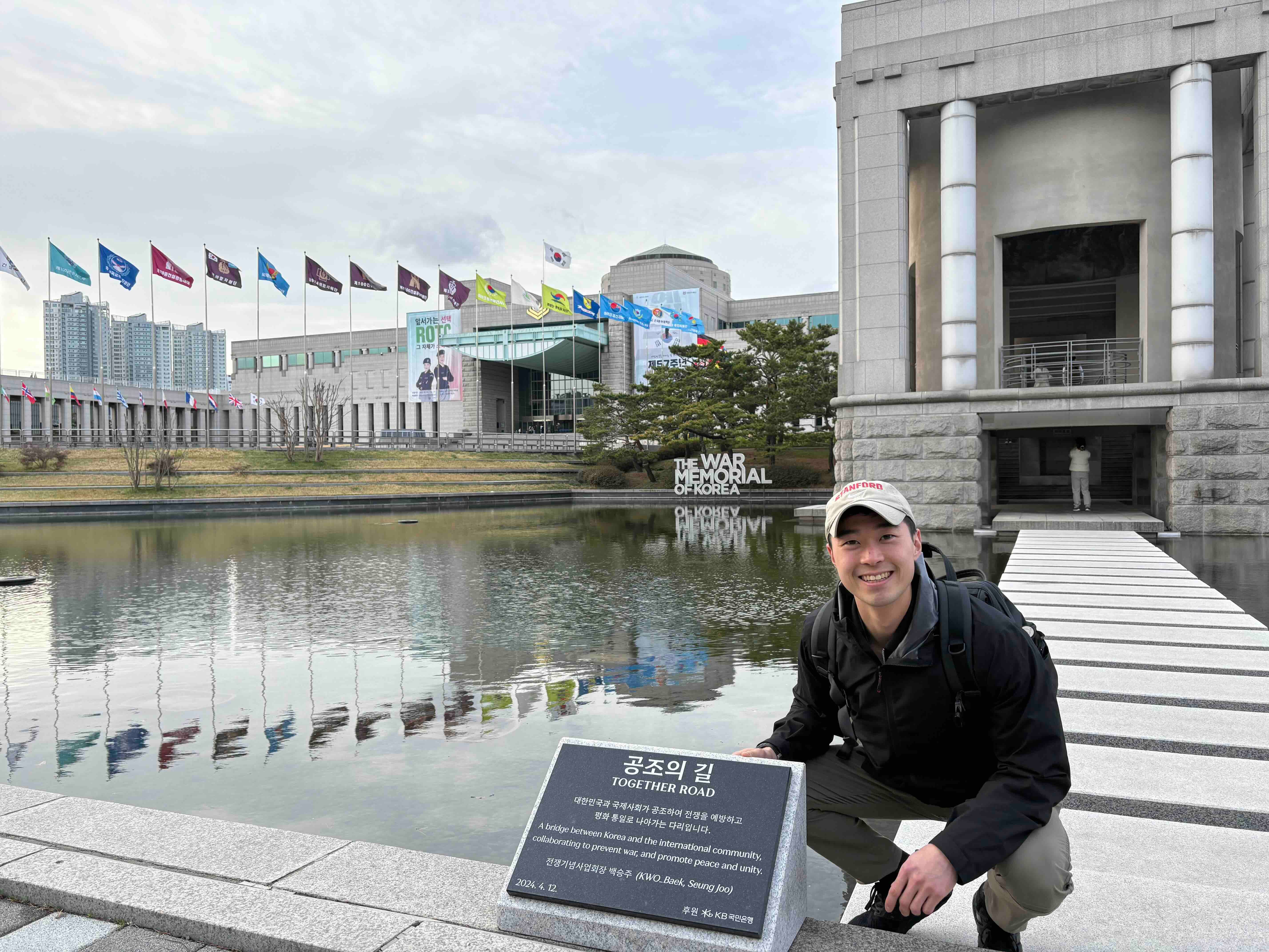 Tyger Cho standing by The War Memorial of Korea.