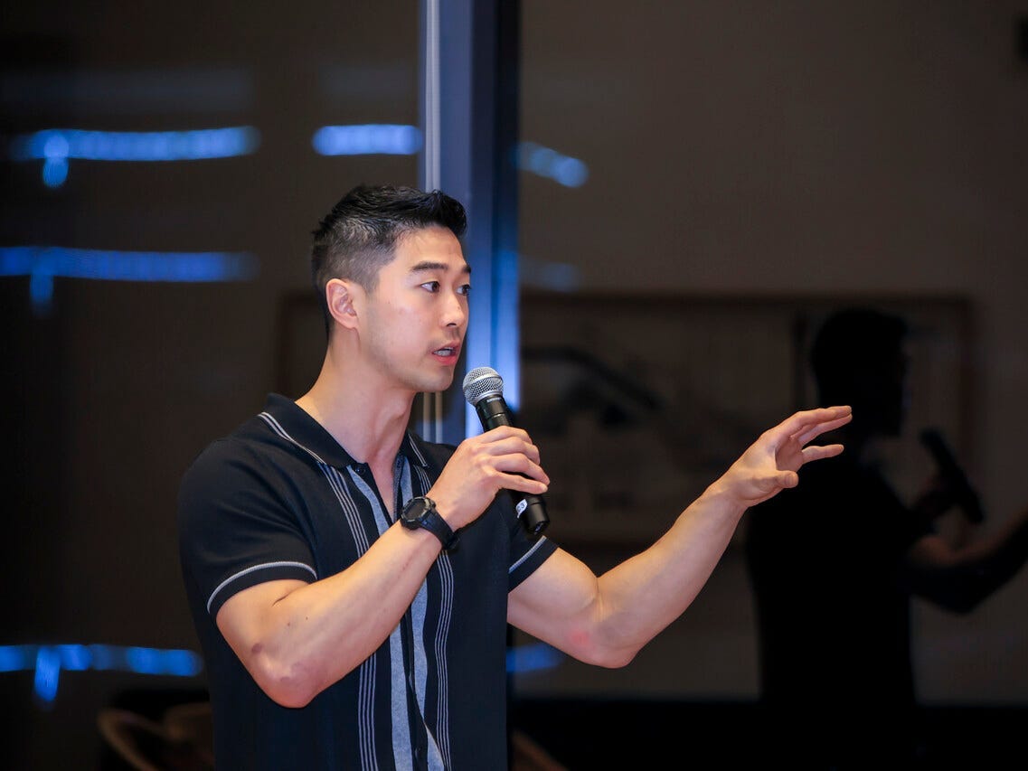 Tyger Cho speaking at a K-Bridge event in Seoul.