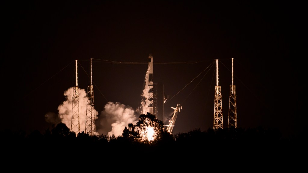 Rocket launching at night.