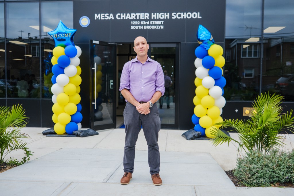 Arthur Samuels, Executive Director of MESA Charter High School, stands outside the school building at its opening.