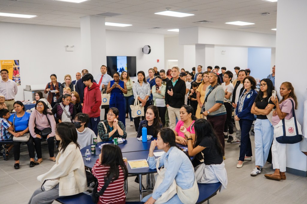 A large group of people at MESA South Brooklyn's opening party.