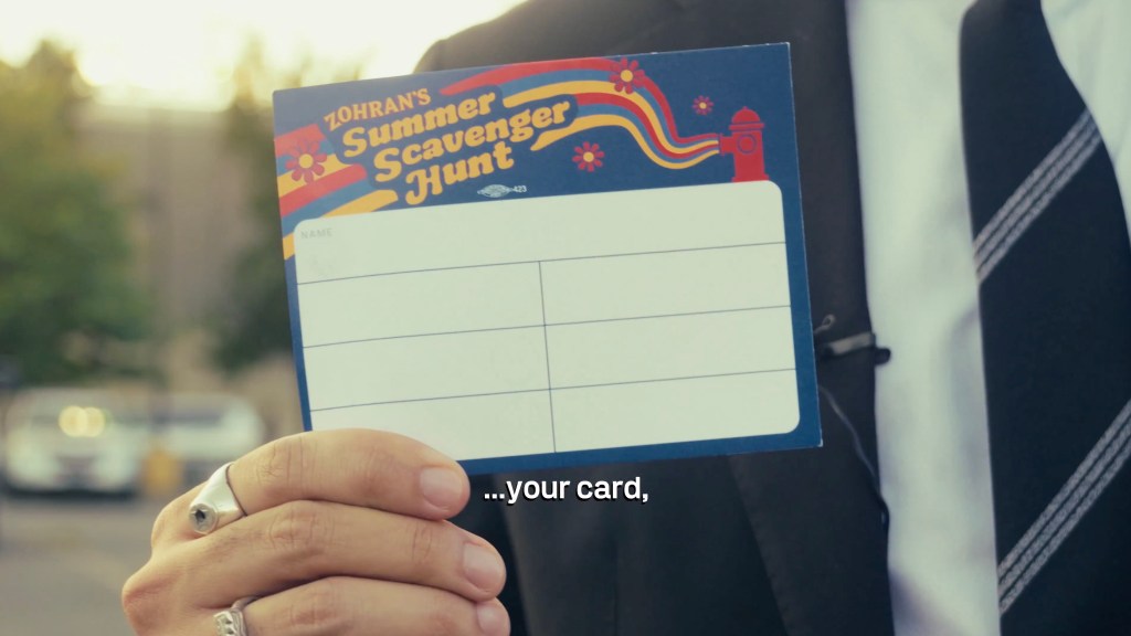 Person holding a blank scavenger hunt card.