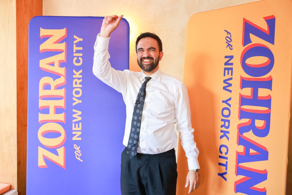 NYC mayoral candidate Zohran Mamdani celebrating with supporters.