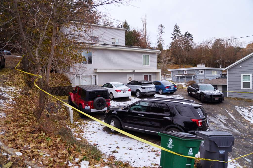 Off-campus house where four University of Idaho students were murdered; crime scene tape visible.
