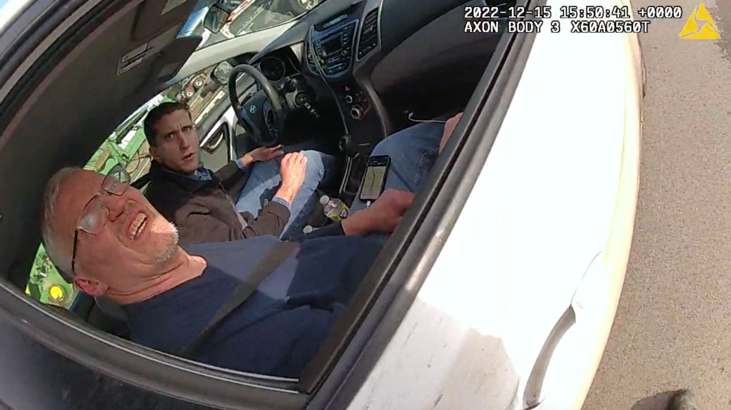Bodycam footage of Brian Kohberger and a man believed to be his father in a white Hyundai Elantra during a traffic stop.