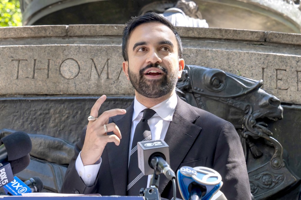 Zohran Mamdani speaking at a press conference.