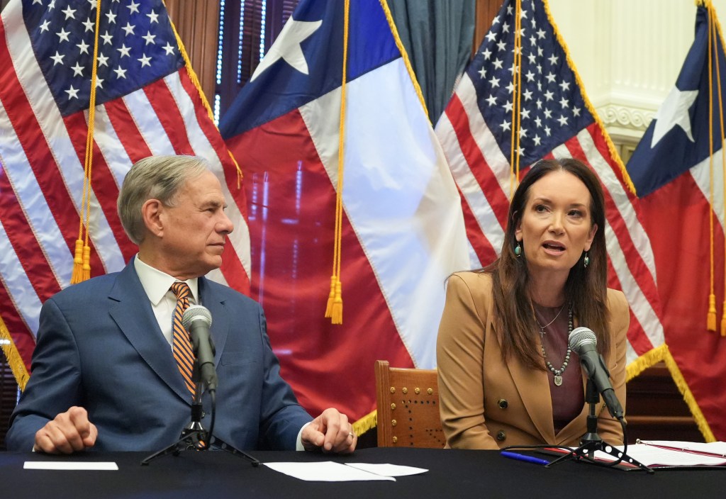 Gov. Greg Abbott listens to U.S Secretary of Agriculture Brooke Rollins speak on plans to fight the New World screwworm at a news conference at the Capitol in Austin, Friday, Aug. 15, 2025. 