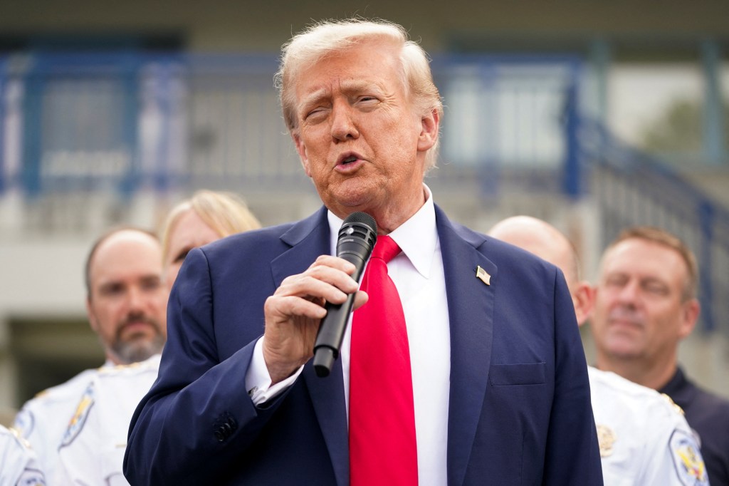 President Trump speaking at a microphone.