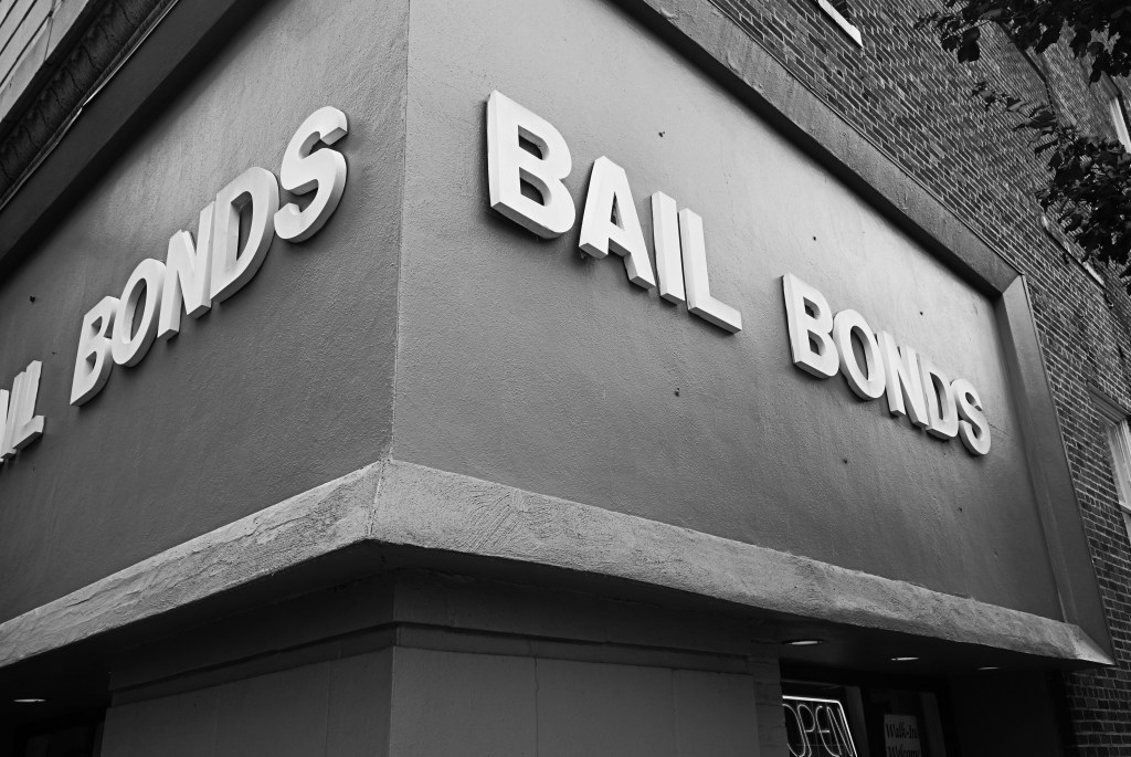 Black and white photo of a bail bonds office.