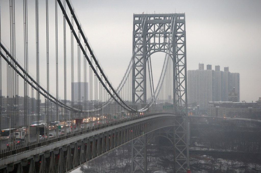 Traffic moves over the Hudson River and across the George Washington Bridge between New York City (R), and in Fort Lee, New Jersey on December 17, 2013.