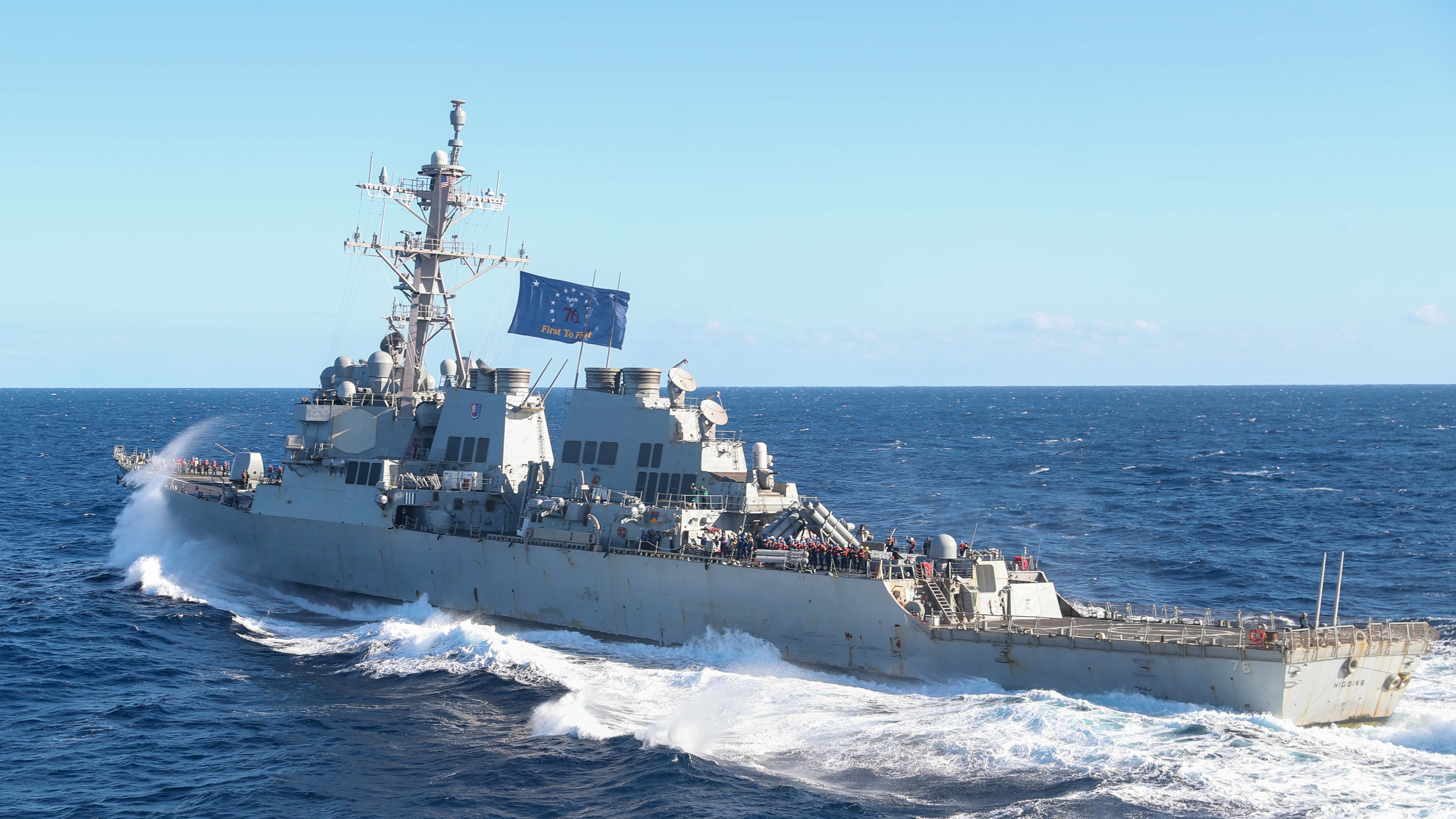 Arleigh Burke-class guided-missile destroyer USS Higgins (DDG 76) pulls away from Nimitz-class aircraft carrier USS George Washington (CVN 73) after conducting a fueling-at-sea while underway in the Pacific Ocean, Nov. 7, 2024.