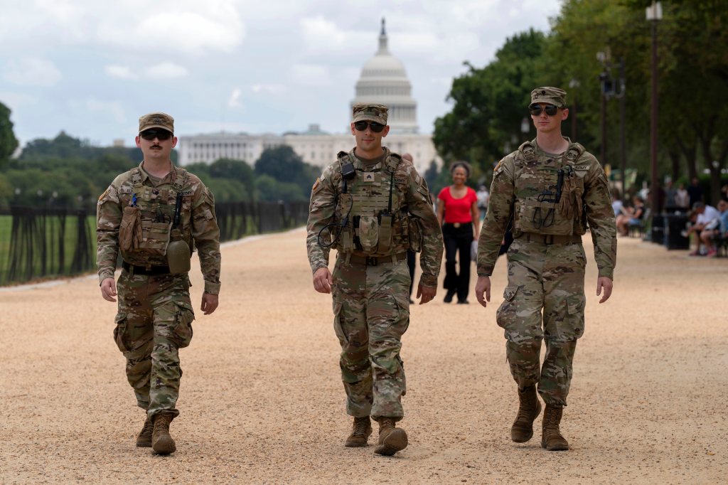 Members of the Louisiana National Guard patrol the National Mall, Sunday, Aug. 24, 2025, in Washington. 