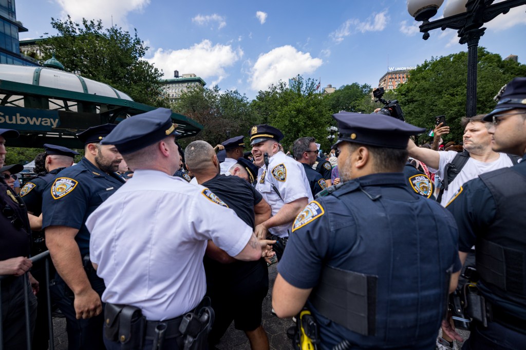 A counter protester is arrested as people participate in a rally and a protest throughout New York City's 5 boroughs upon the release of Palestinian activist Mahmoud Khalil after spending over 3 months at a Louisiana detention center on June 21, 2025 in New York City.