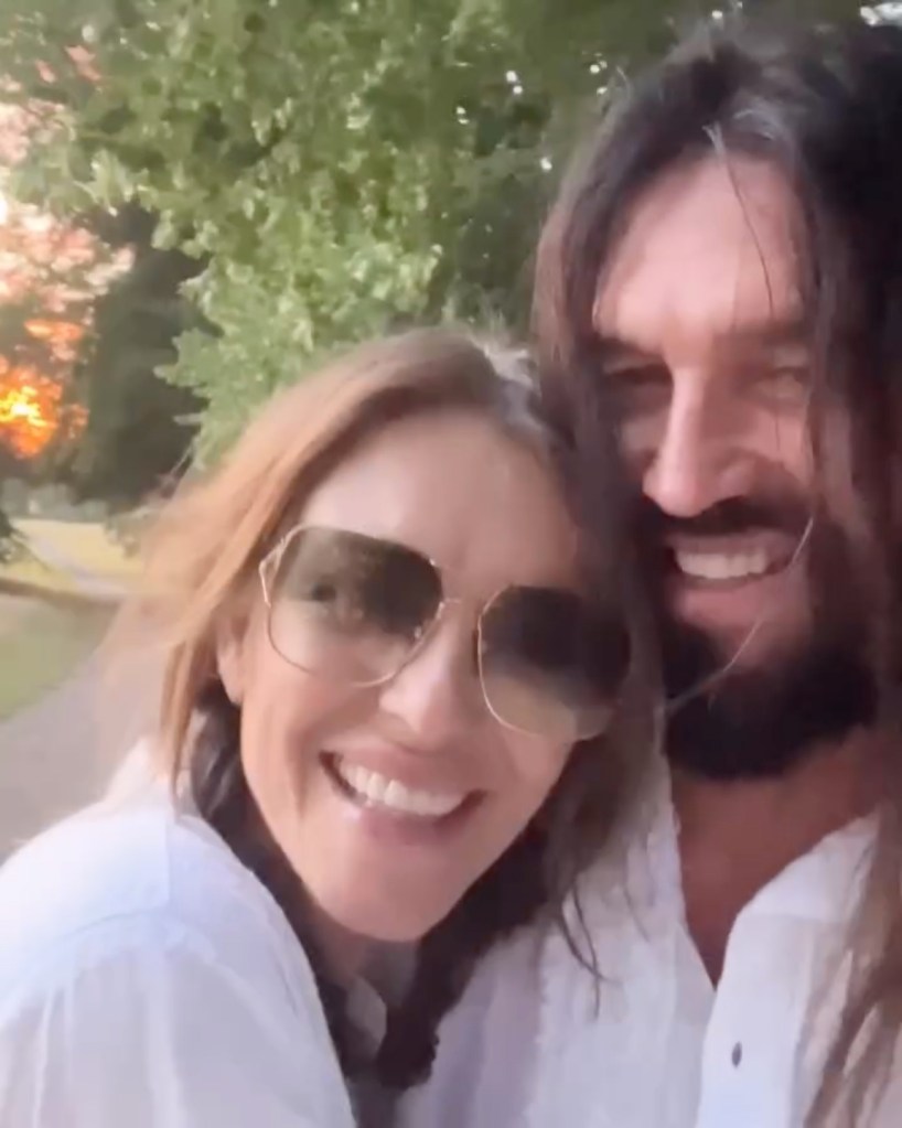 Elizabeth Hurley poses with Billy Ray Cyrus.