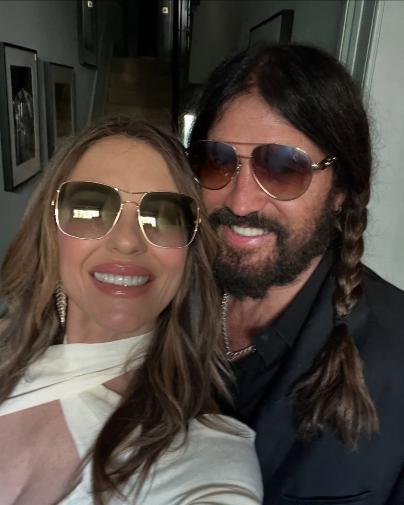 Elizabeth Hurley poses with Billy Ray Cyrus.
