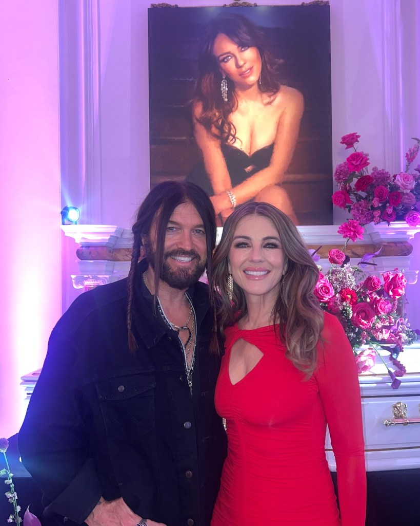 Elizabeth Hurley poses with Billy Ray Cyrus.