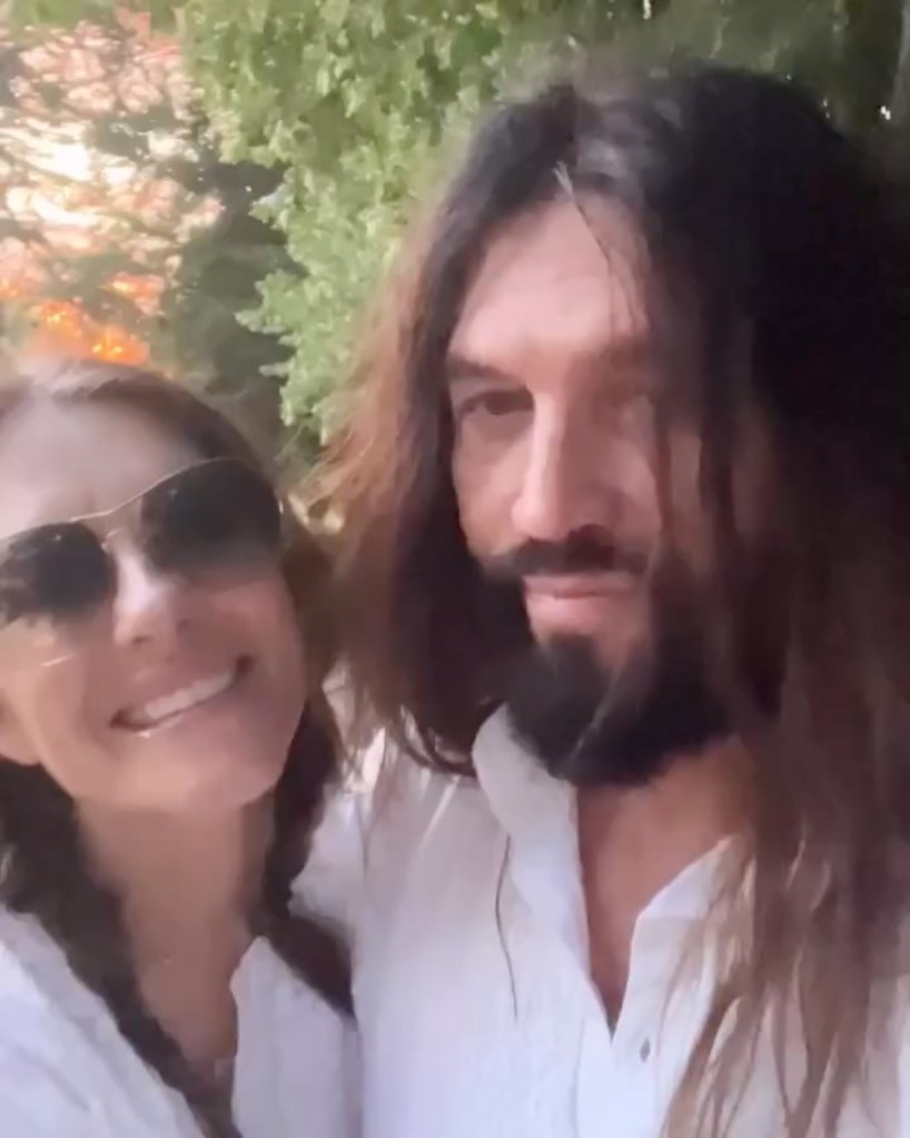 Elizabeth Hurley poses with Billy Ray Cyrus.