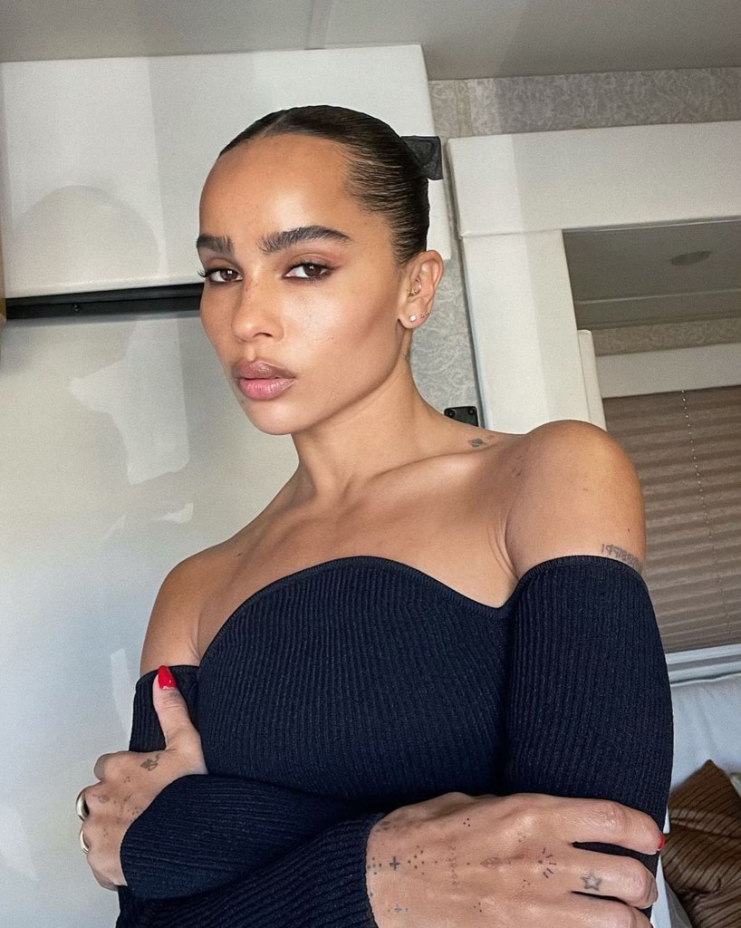 Zoë Kravitz in an off-the-shoulder black shirt. 