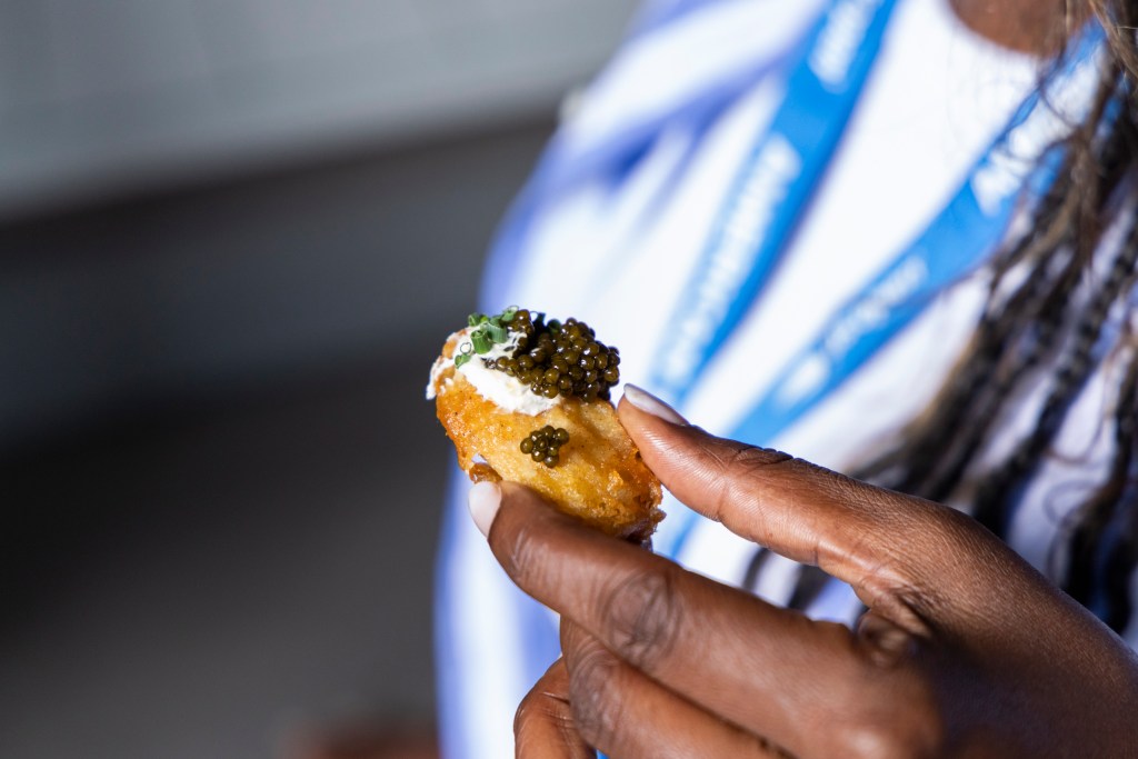 Chicken nugget topped with caviar.