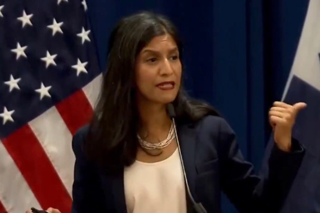 Insha Rahman speaking at a press conference.