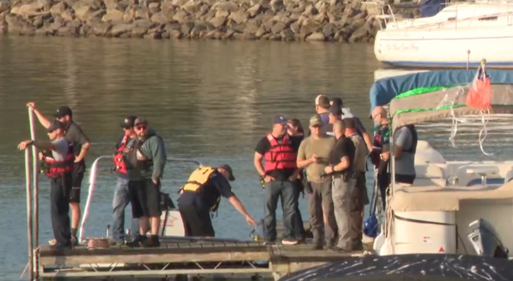 Emergency responders at a lake.