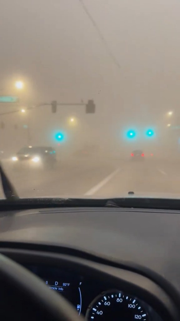 Phoenix dust storm with near-zero visibility, impacting traffic.