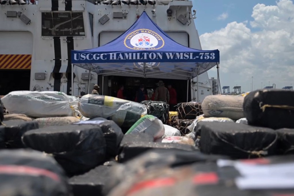 Coast Guard ship unloading seized drugs.