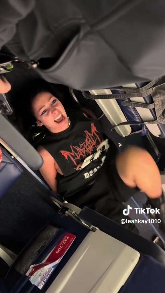 Woman restrained on airplane.